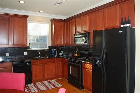 black stainless steel appliances in cherry color cabinets|off white cherry cabinet colors.